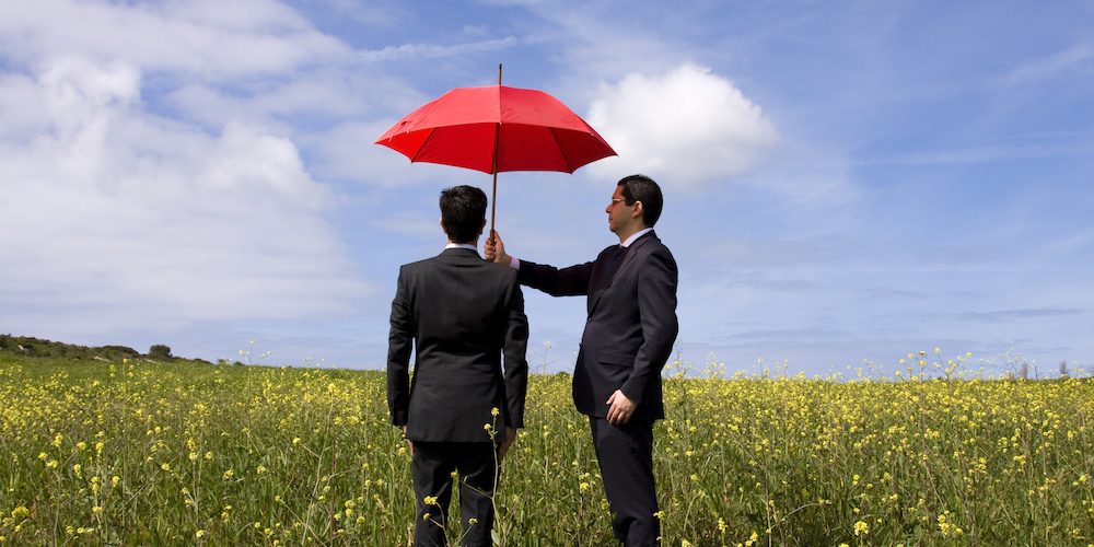 business man holding umbrella Jefferson City MO